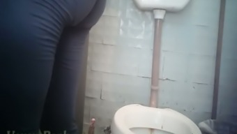 White pale skin pregnant chick filmed on hidden cam pissing in the restroom