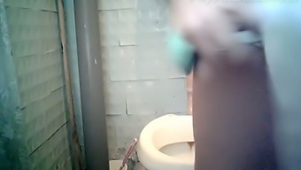 White pale skin chick in the toilet room filmed from front side
