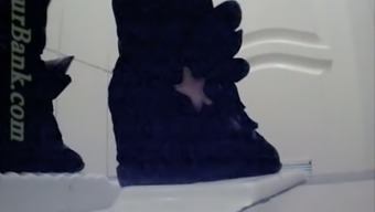 Pale skin white chick in black pants filmed from behind in the toilet