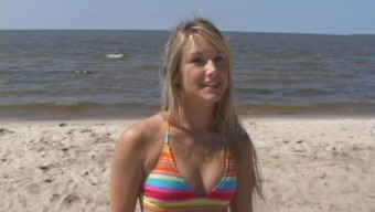Bikini teen strips on the beach and hula hoops in the nude
