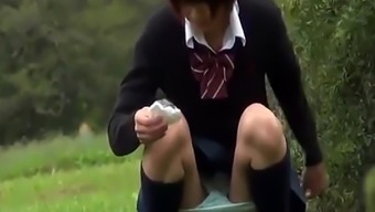 Asian teens pee outdoors