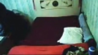 Voyeur tapes an arab hijab girl having missionary sex with a guy on the bed