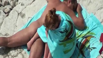 Voyeur tapes couple fucks on the beach