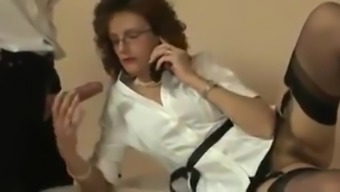 British milf plays with a cock while on the phone