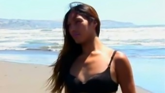 Camila the Latin tranny masturbates on a beach