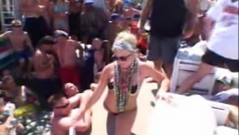 Hot babes enjoy teasing men with their bodies during a beach party