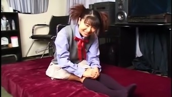 Weird looking pigtailed coed chick Yuri Mitsui squeezes her own tits
