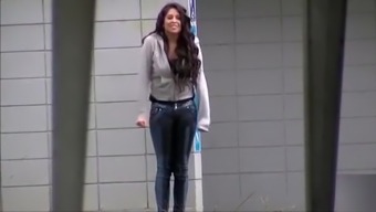 Desperate chick wetting her jeans on the street