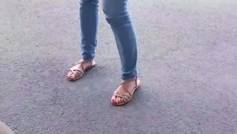 Candid feet of a secretary in sandals