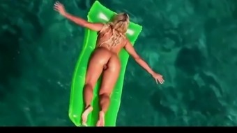 Hot blonde milf naked in ocean on public beach
