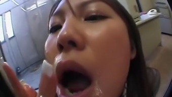 Naughty Japanese secretary gets a huge load of cum all over her face