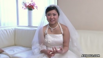 Naughty Japanese bride Emi Koizumi lets dude rub her clit and play with tits
