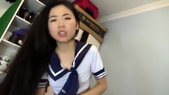 Japanese teen in uniform sucks jerks POV cock