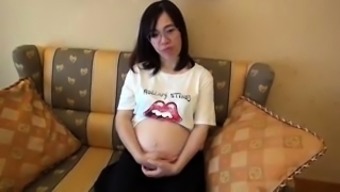 Pregnant Japanese babe with big natural tits loves to fuck