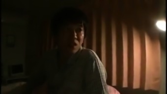 Lustful Japanese mom gets nailed by a young guy on the bed