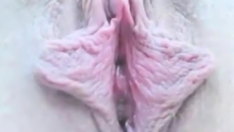 Rubbing her big clitoris