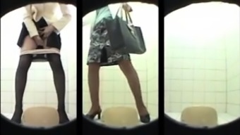 Amateur Asian schoolgirls going to the toilet on hidden cam