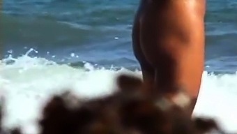 Public voyeur enjoys nude beach sex