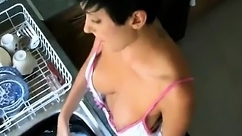 downblouse of Kim doing the dishes