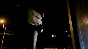 Crossdresser waiting for bus in short dress at night