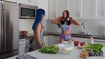 Two housewives are cooking and making love right on the kitchen table