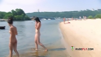 Beautiful amateur nude beach girl is showing her shaved pussy