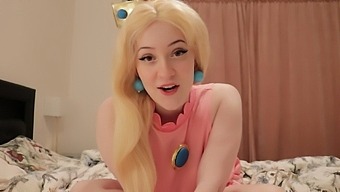 Amateur blonde in a princess-peach outfit has sex while admiring her huge breasts
