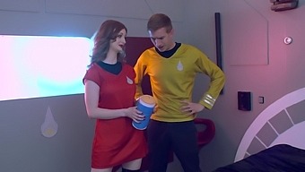 Two busty redheads get their fill of cock in a futuristic threesome