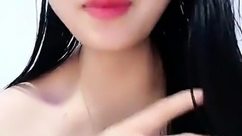 Pretty Japanese teen pleasures herself on webcam